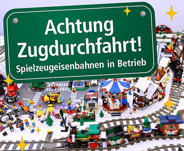 Symbolbild zur Weihnachtsausstellung: Achtung Zugdurchfahrt! Spielzeugeisenbahnen in Betrieb