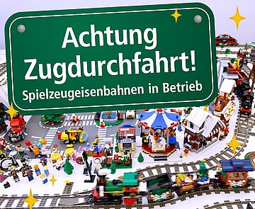 Symbolbild zur Weihnachtsausstellung: Achtung Zugdurchfahrt! Spielzeugeisenbahnen in Betrieb