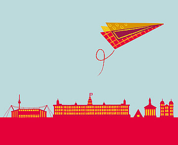 Siluette der Stadt Karlsruhe, türkiser Himmel, roter, gemusterter Papierflieger